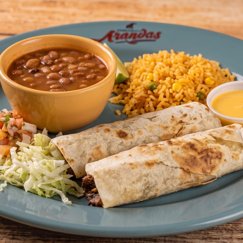 Two burritos with a side of rice, beans, pico de gallo, shredded lettuce, and cheese sauce.
